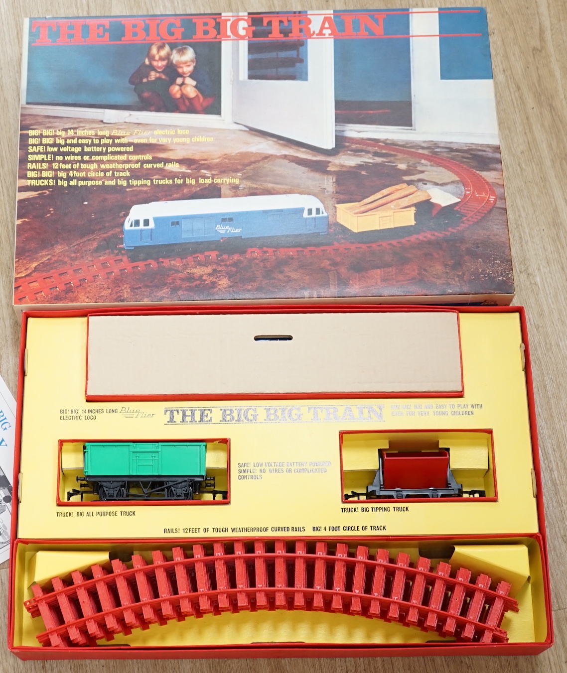 Three Tri-ang The Big Big Train 0 gauge train sets, all with a ‘Blue Flyer’ diesel locomotive and rolling stock, track sections, etc.